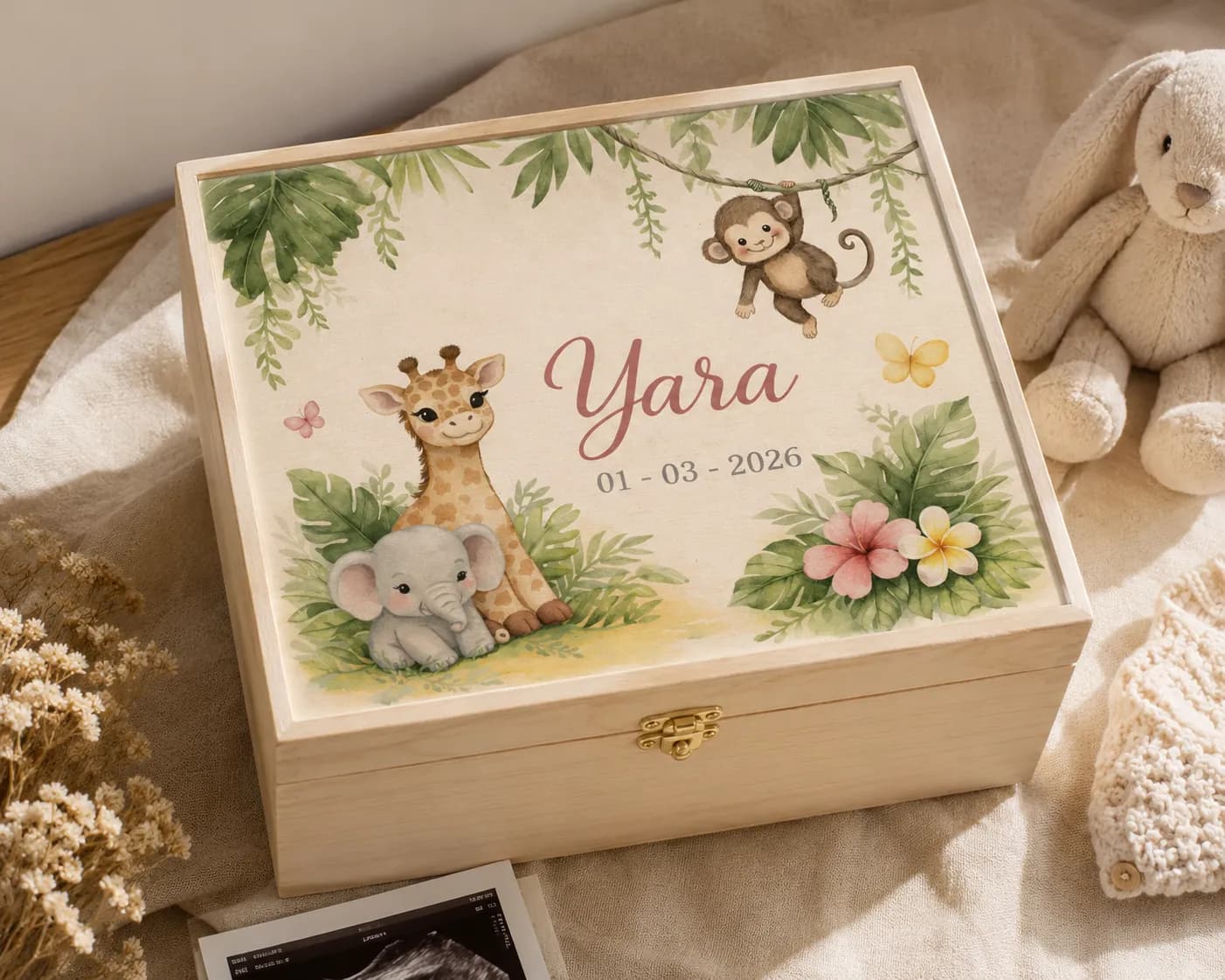 Wooden memory box with Yara's jungle birth announcement design on the lid