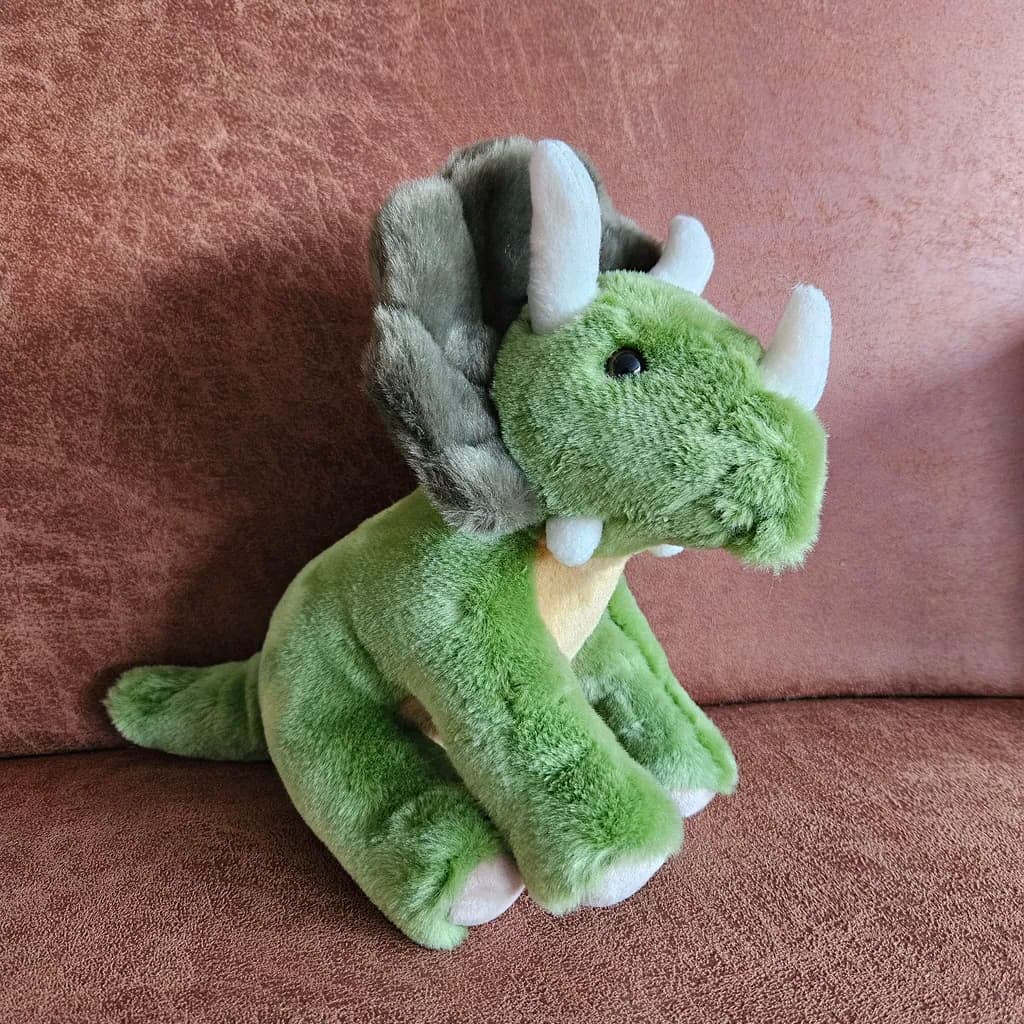 De geliefde dino-knuffel van Otis